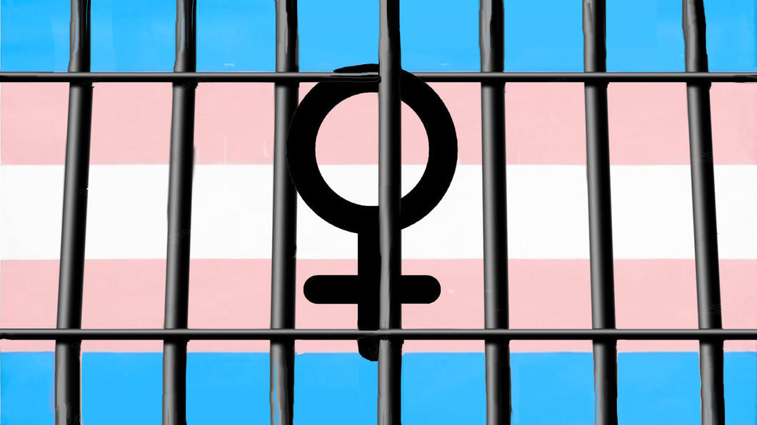 vrouwenteken-tegen-transgendervlagachtergrond en tralies ervoor